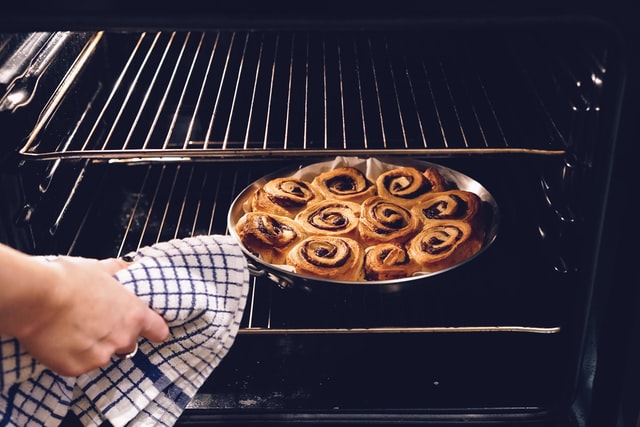 How do I know if my oven needs cleaning?